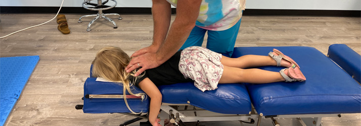Chiropractor Cocoa Beach FL Bret Glas Adjusting Child